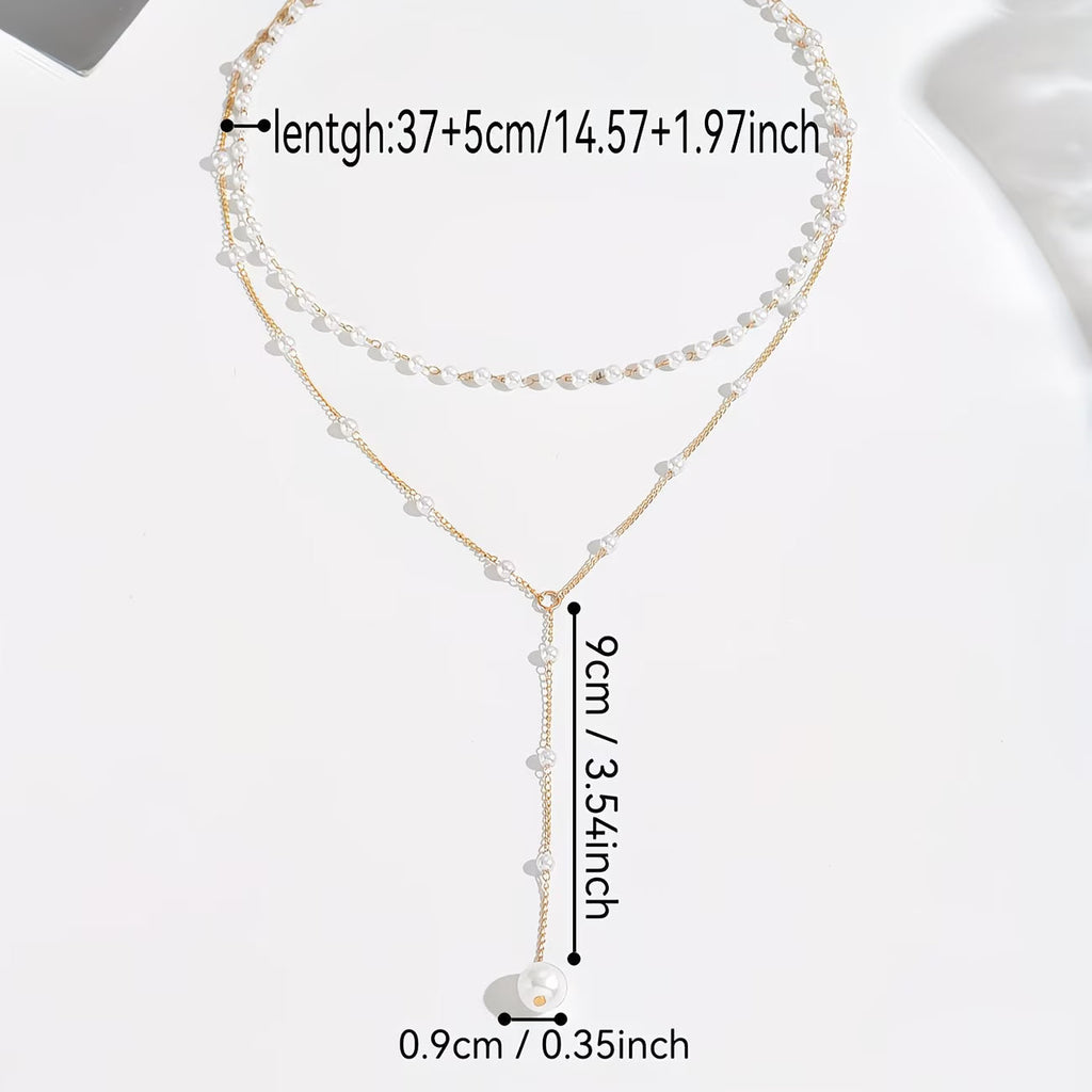 Le collier à rangs de perles graduées