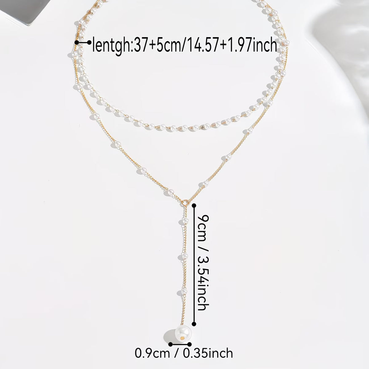 Le collier à rangs de perles graduées