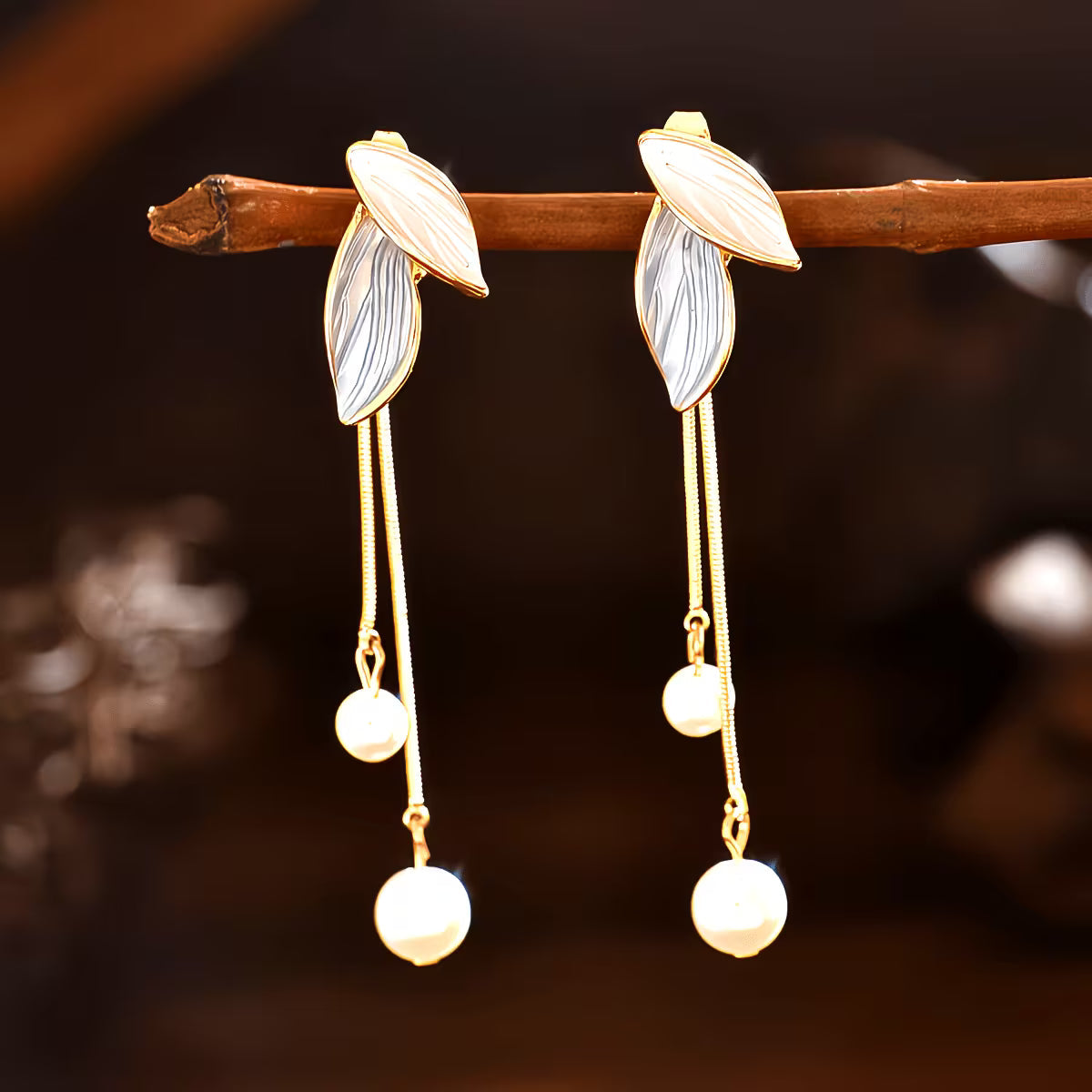 Longues boucles d'oreilles feuille avec perles