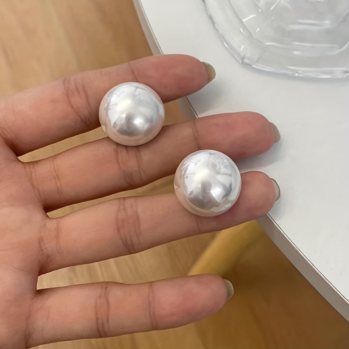 Les boucles d'oreilles perles statement