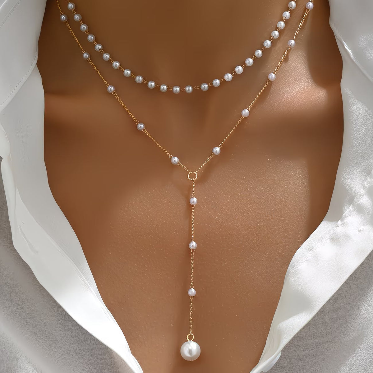 Le collier à rangs de perles graduées