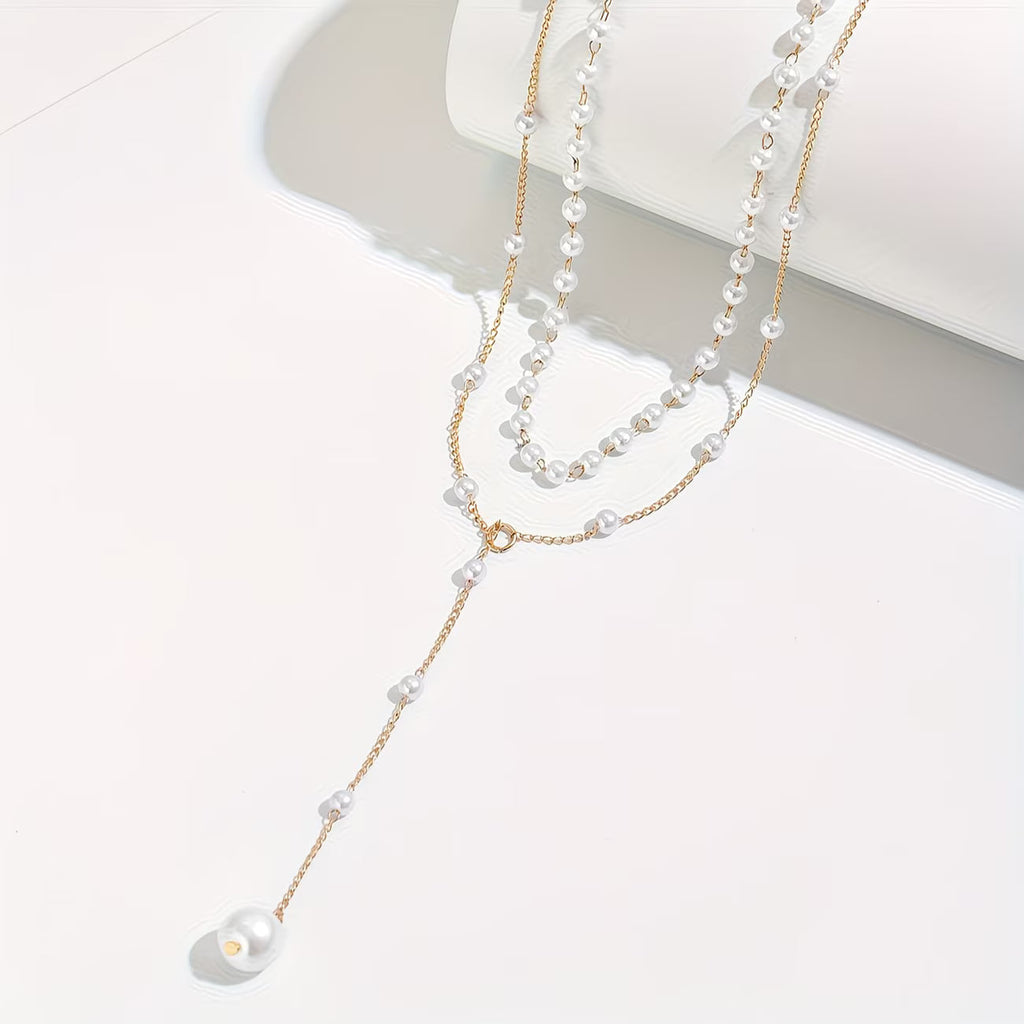 Le collier à rangs de perles graduées